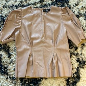 Lulu’s mauve pink vegan leather blouse.
